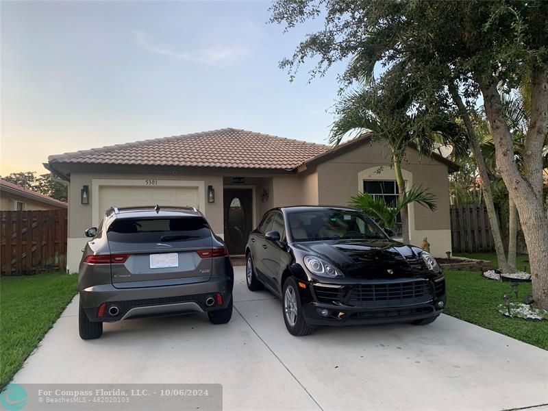 a car parked in front of a house