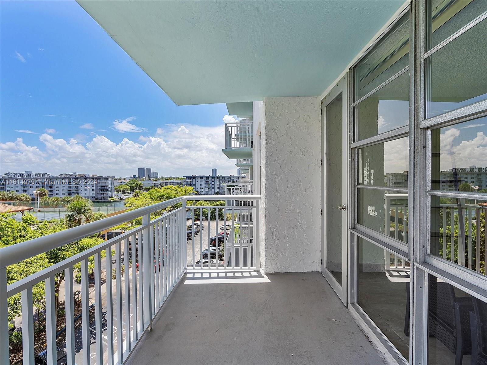 a view of balcony with furniture