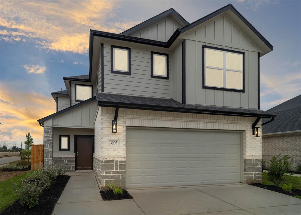 a front view of a house with garage