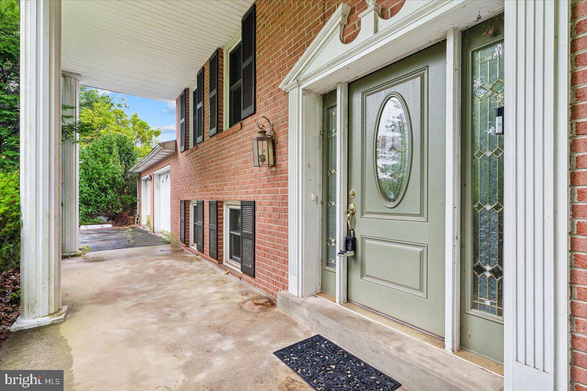 a view of a house with a door and wooden floor