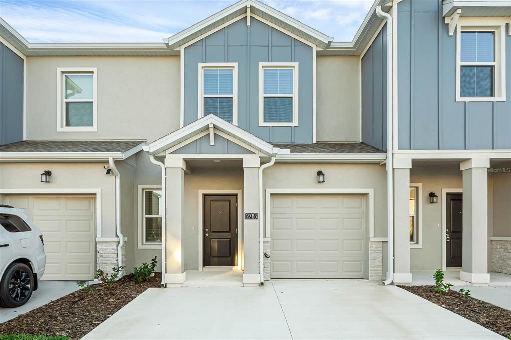 a front view of a house with a garage