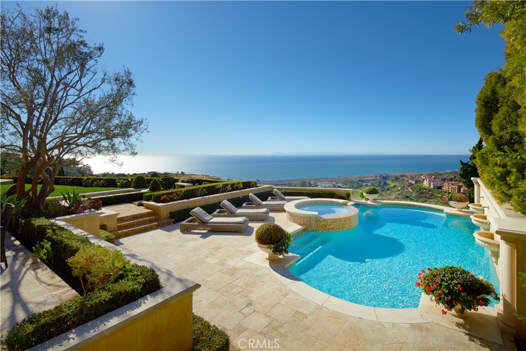 a view of a swimming pool with outdoor seating