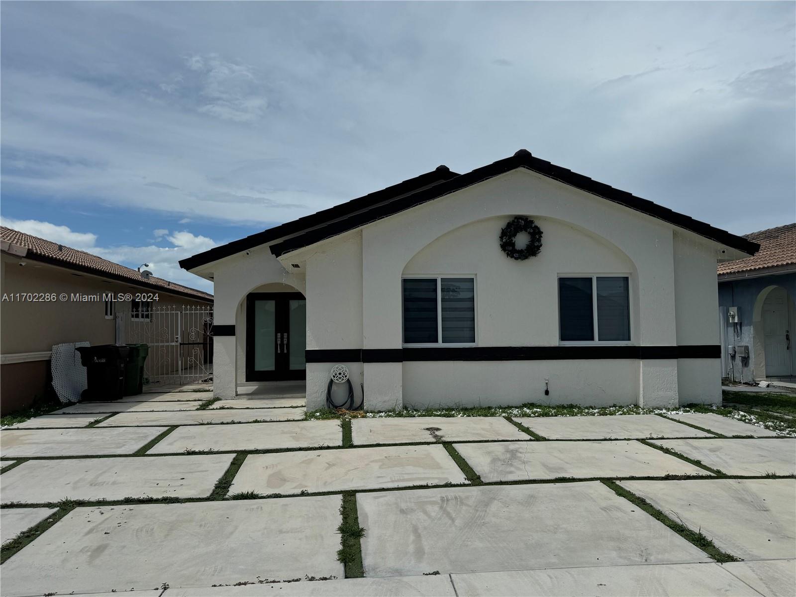 a front view of a house with garage