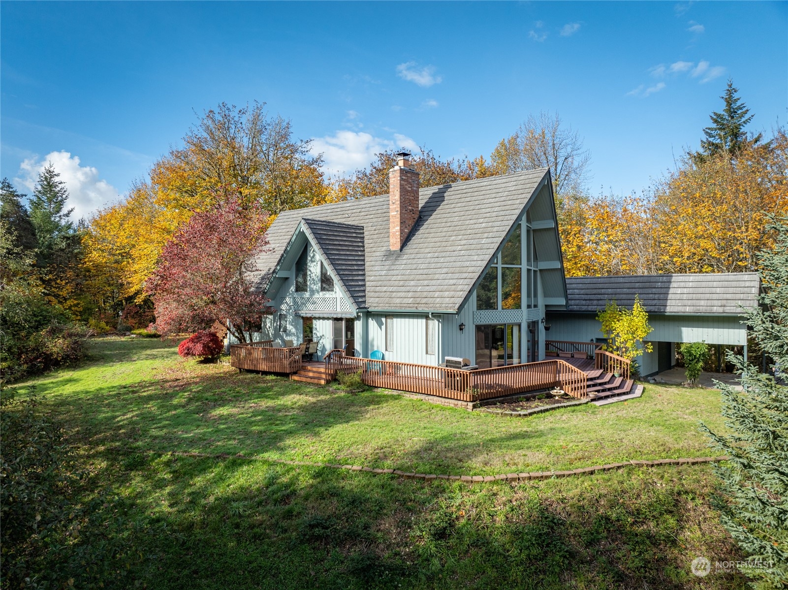 a view of a house with backyard porch and sitting area