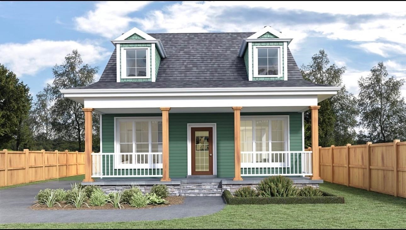 a front view of a house with a garden