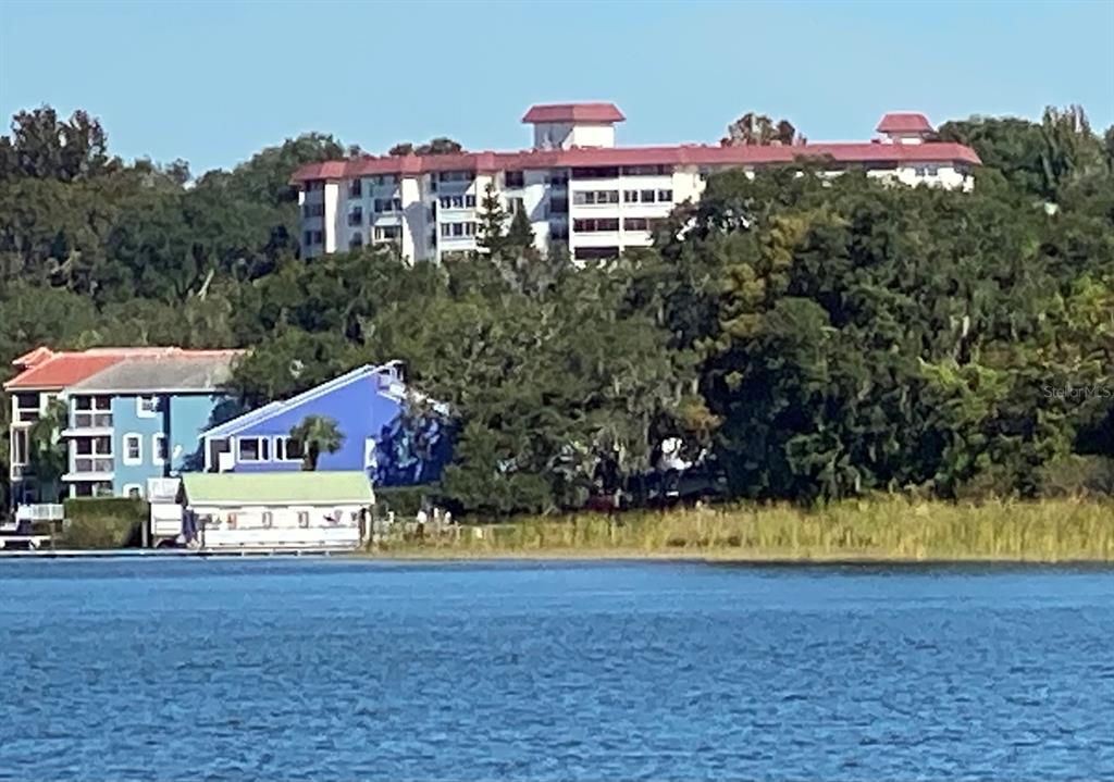 a view of houses with swimming pool and yard