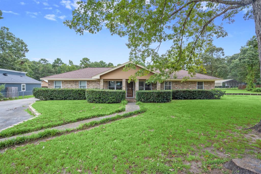 a front view of a house with a yard and porch