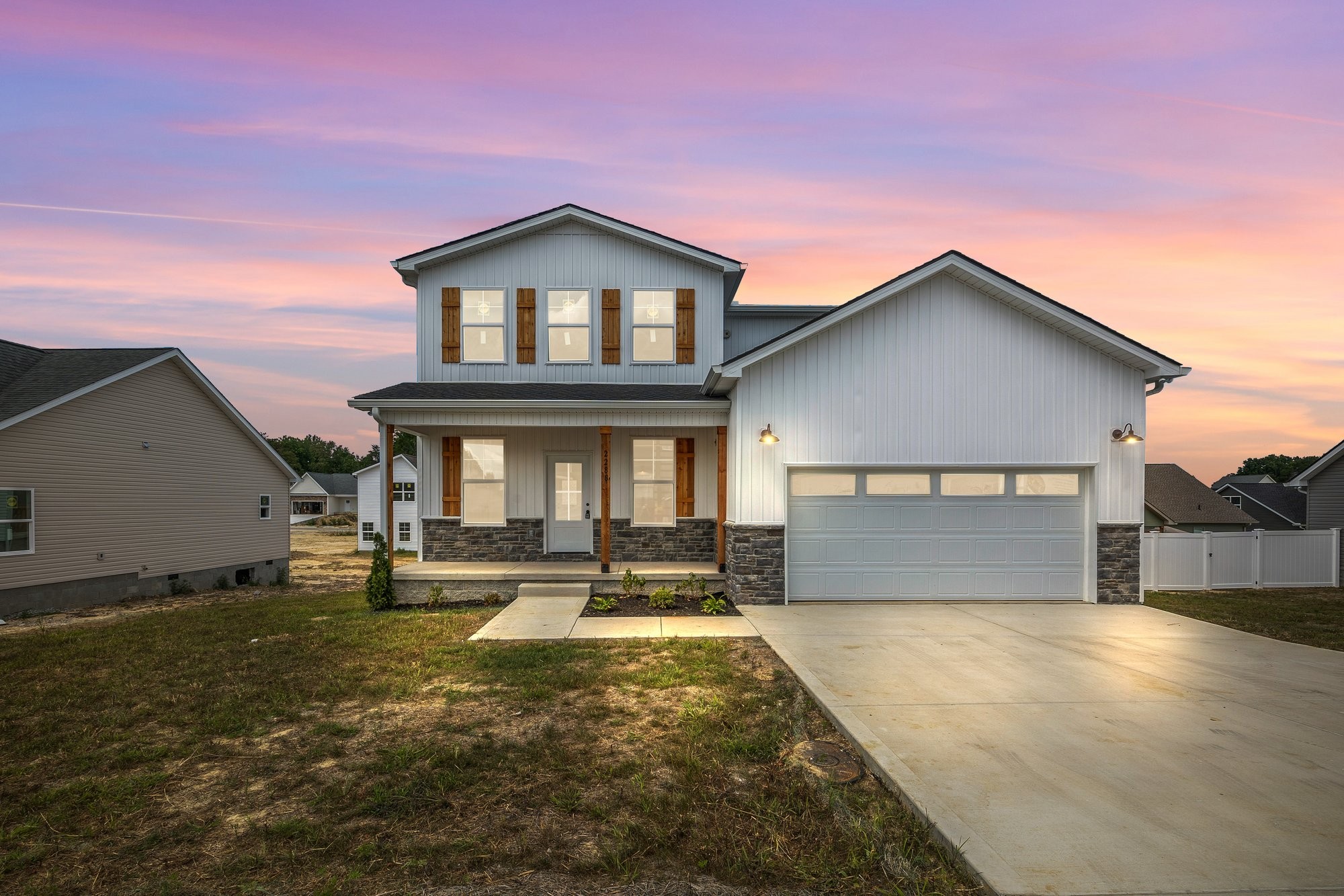 a front view of a house with a yard