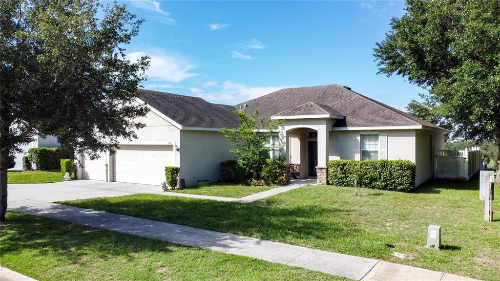 a front view of a house with a yard