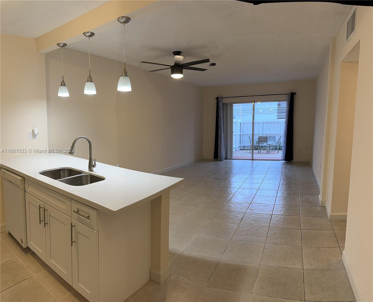 a kitchen with a sink and a stove