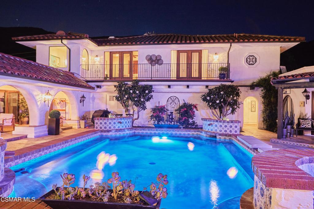 a view of swimming pool with outdoor seating