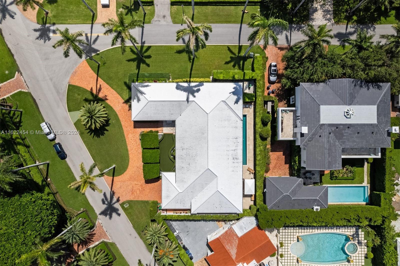 an aerial view of a house with yard swimming pool and outdoor seating