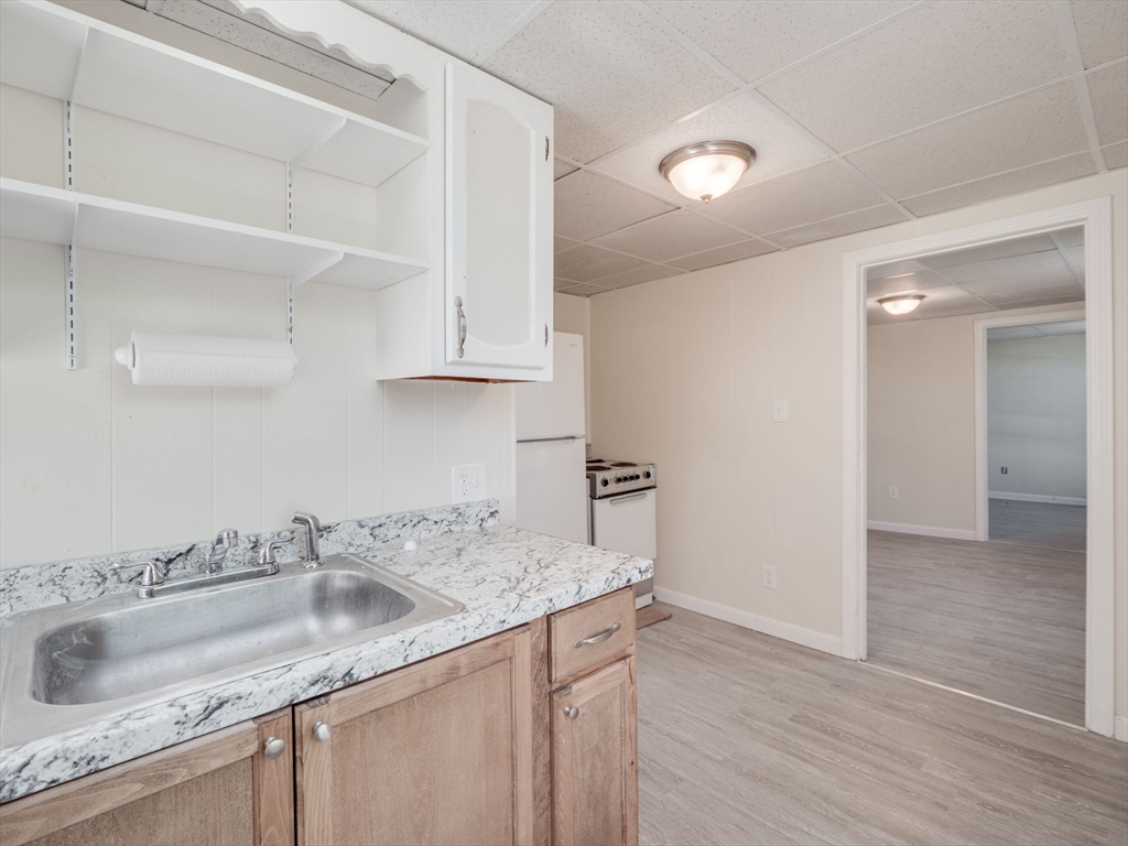 a view white cabinets and sink