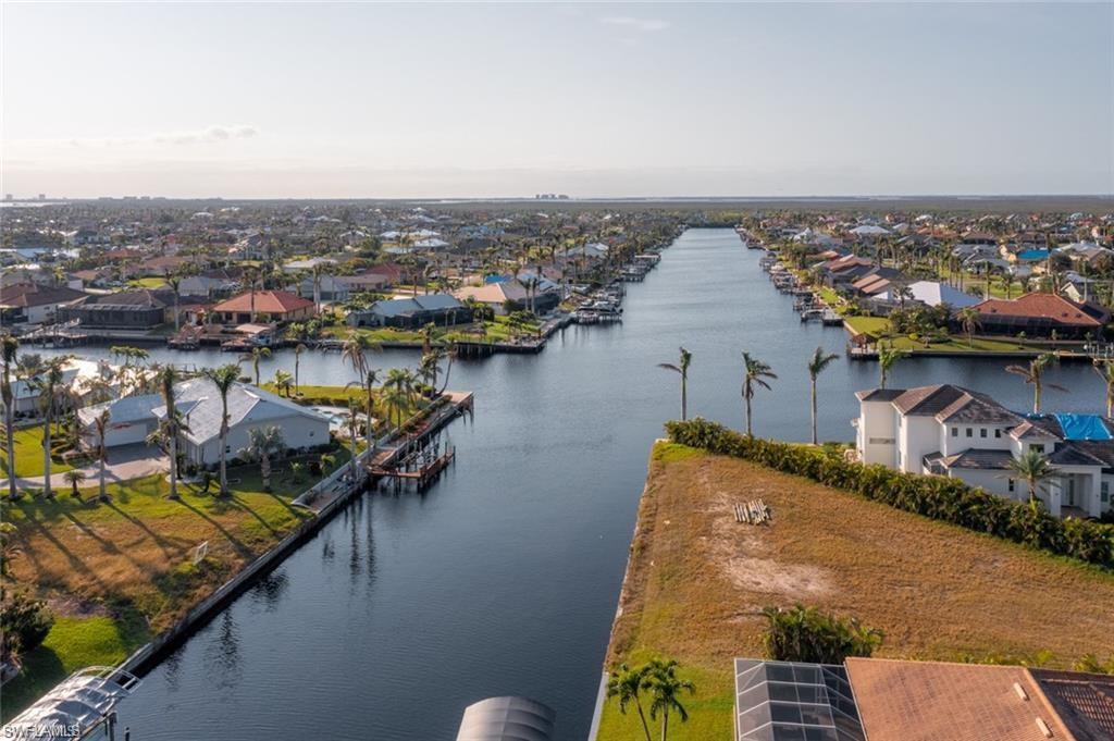 an aerial view of a house with a lake view