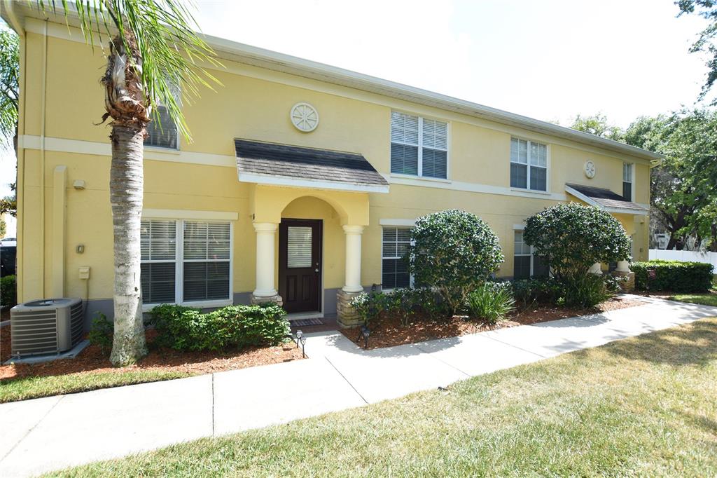 a view of a house with palm trees