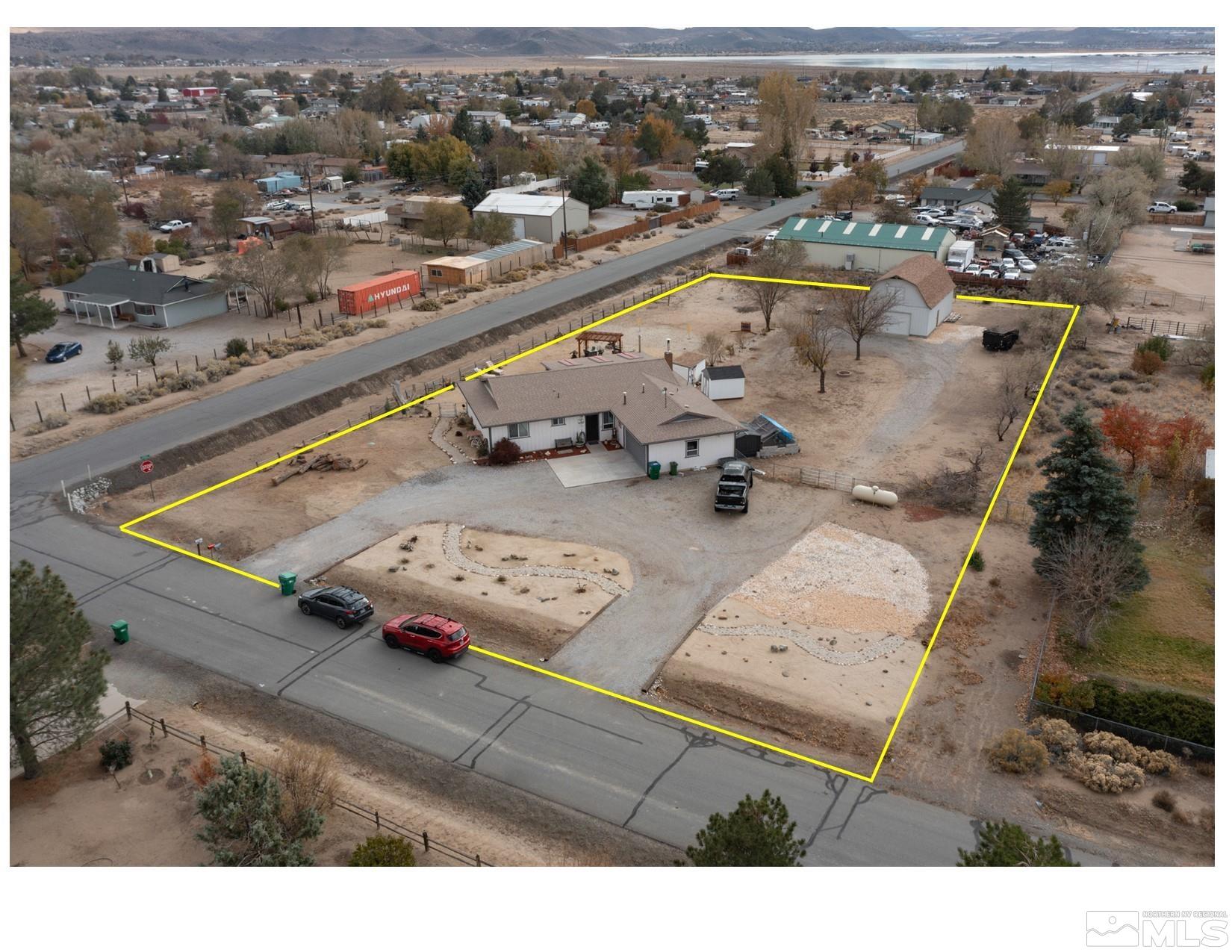 an aerial view of residential houses with outdoor space