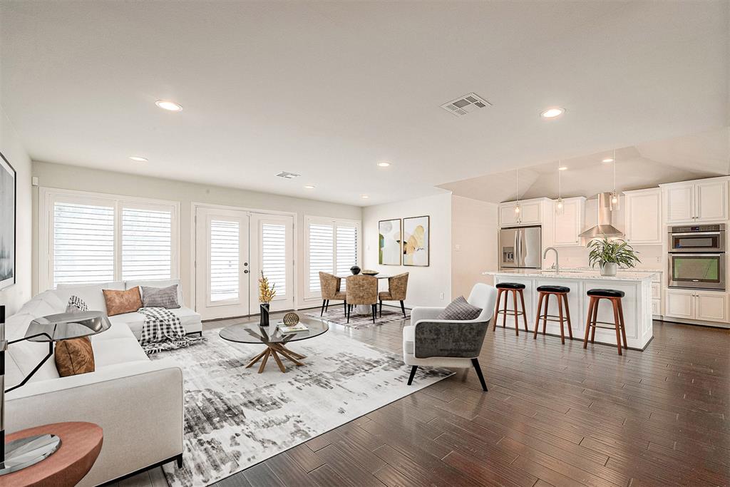 a living room with fireplace furniture and a table