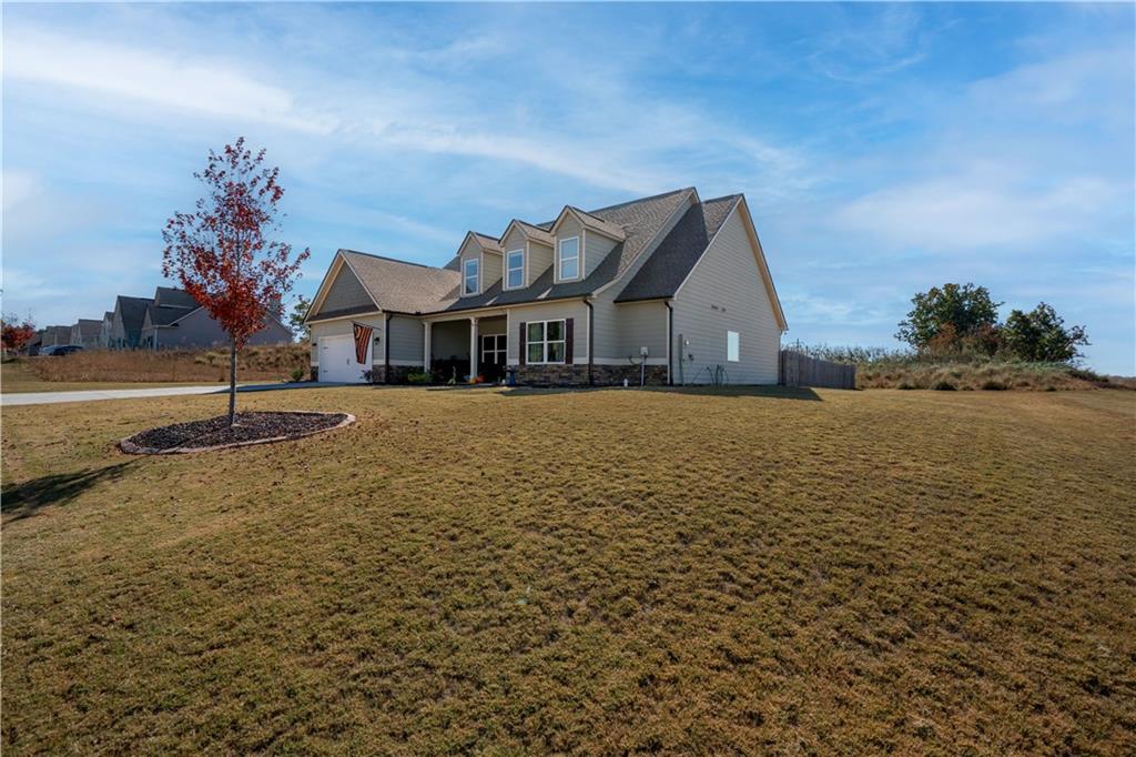 a front view of a house with a yard