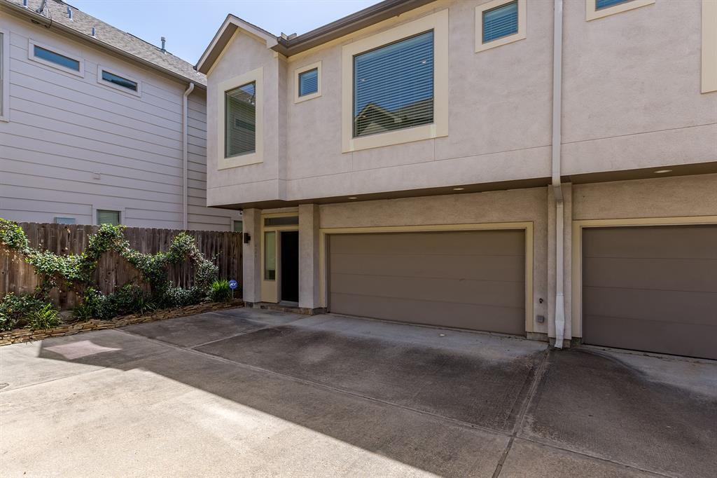 a front view of a house with garage