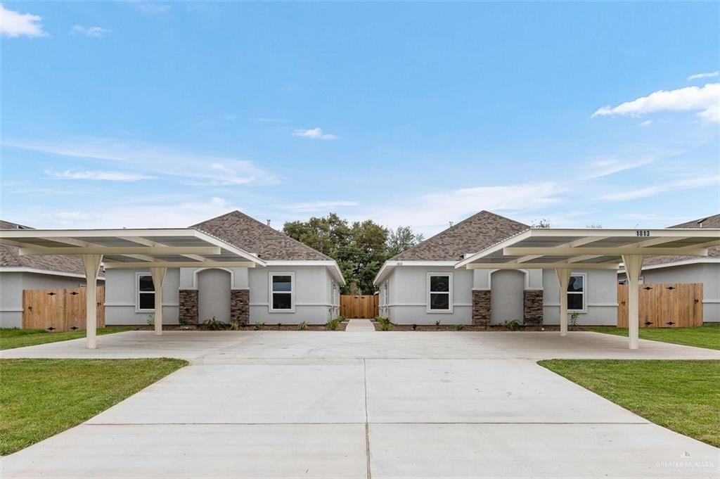 Ranch-style home with a carport and a front lawn