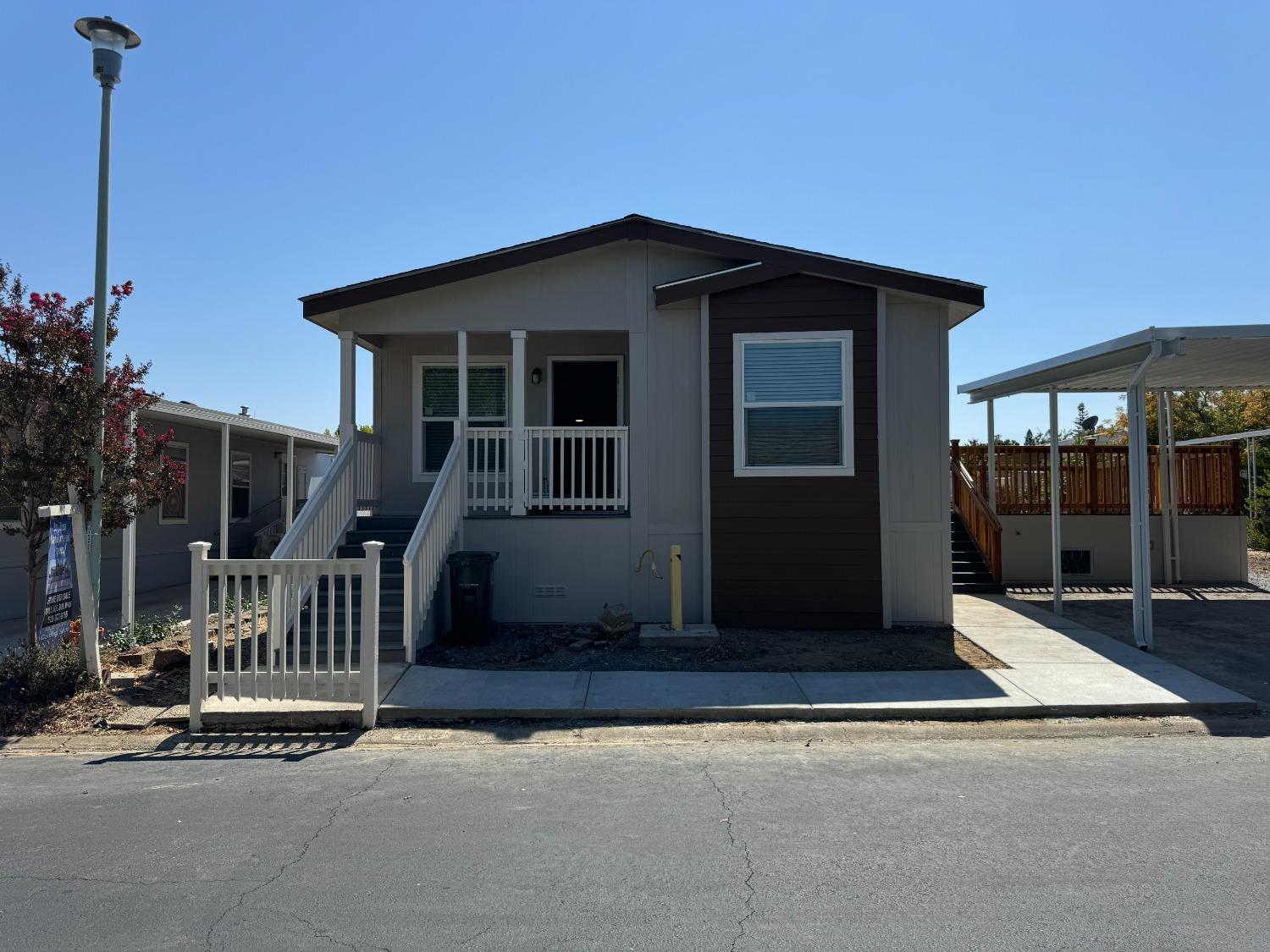 a view of house with porch and entertaining space