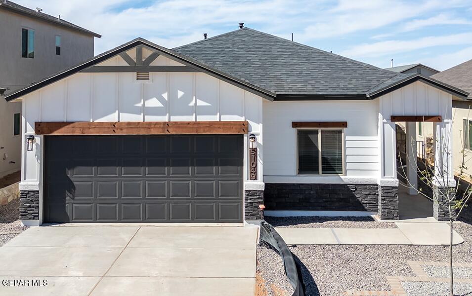 a front view of a house with garage