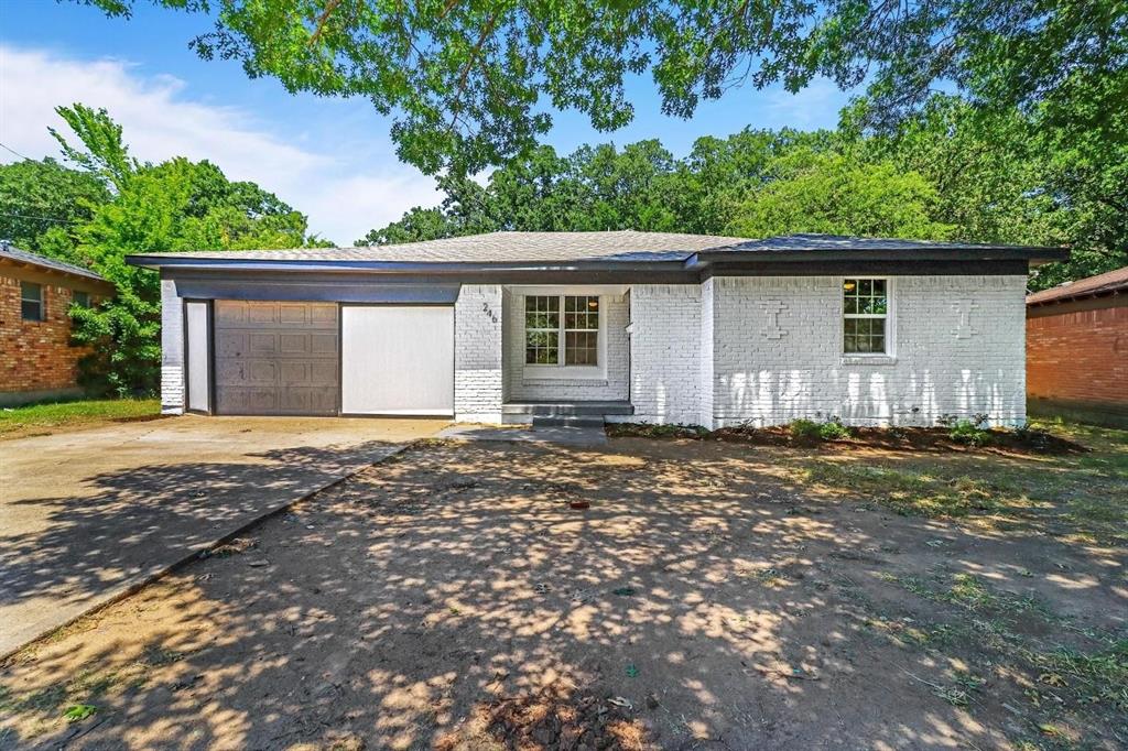 a house with a tree in front of it