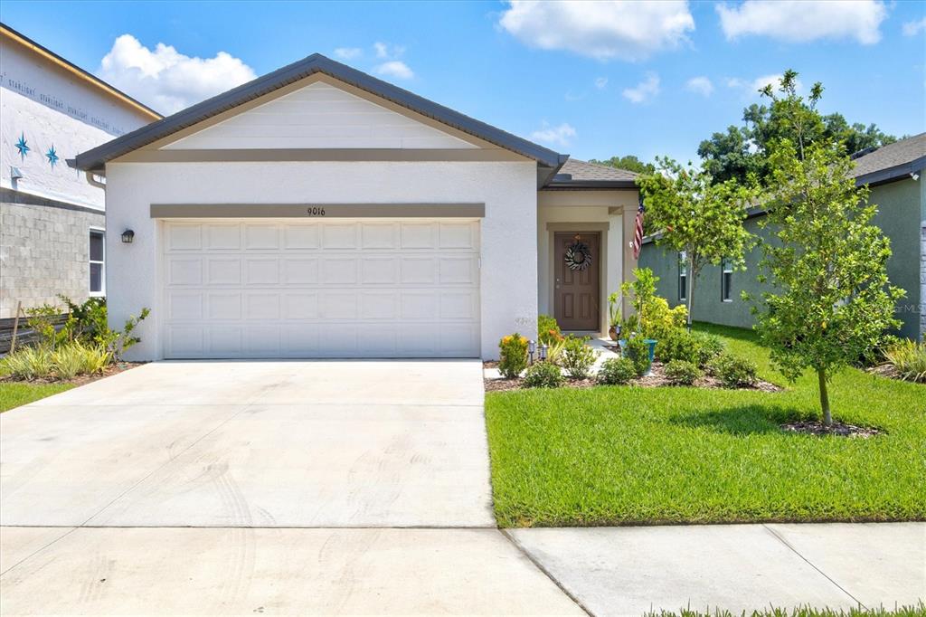 a front view of a house with a yard