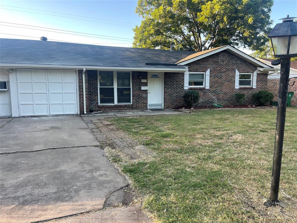 a house with yard in front of it