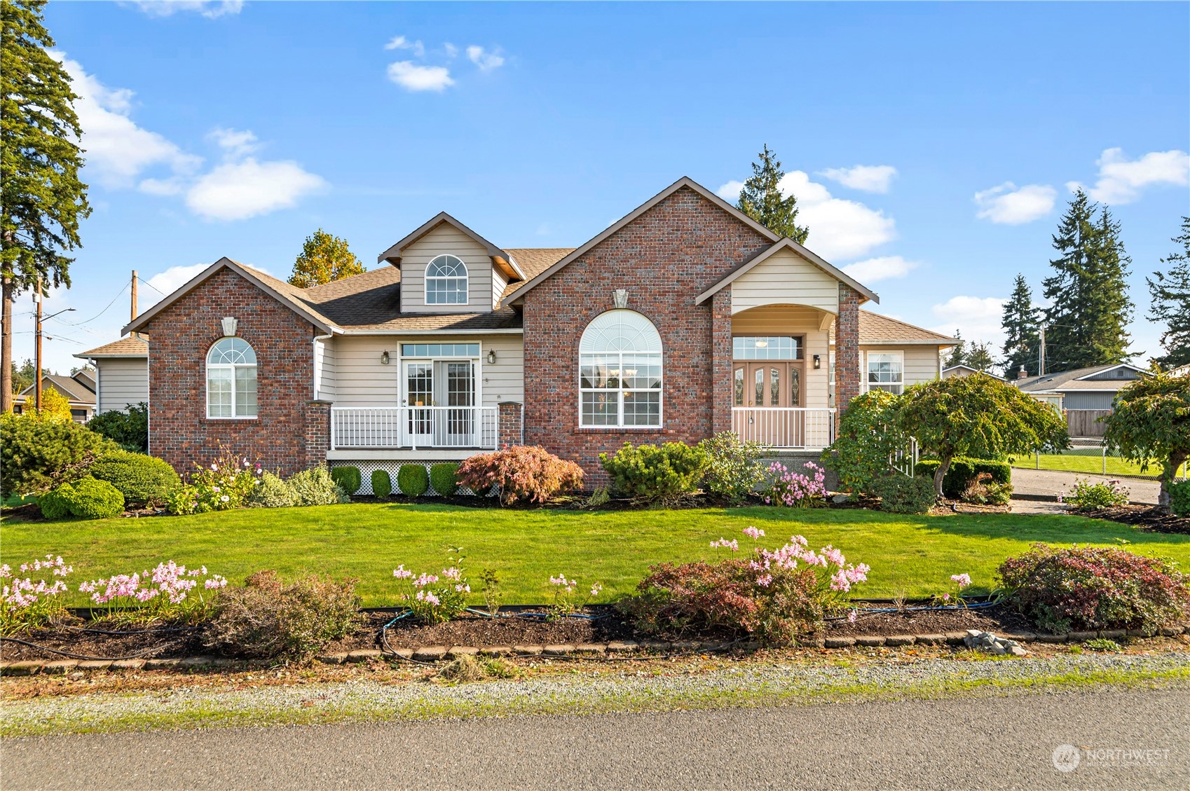 a front view of a house with a yard