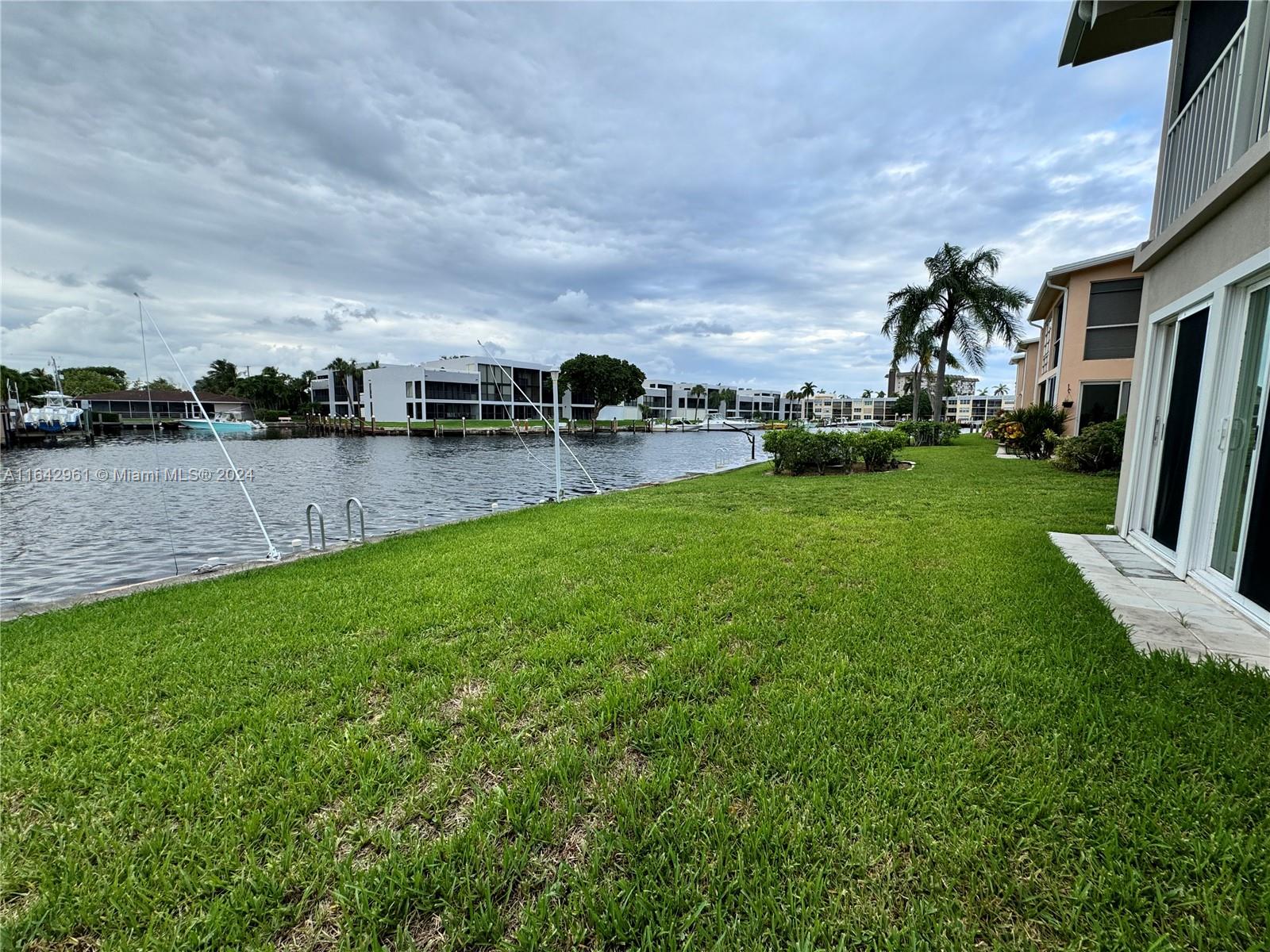 a view of yard with swimming pool and green space