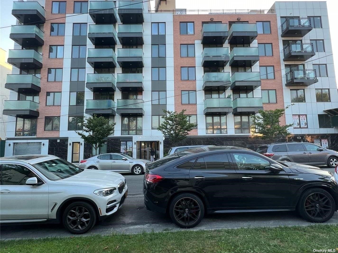 a front view of a house with parking space