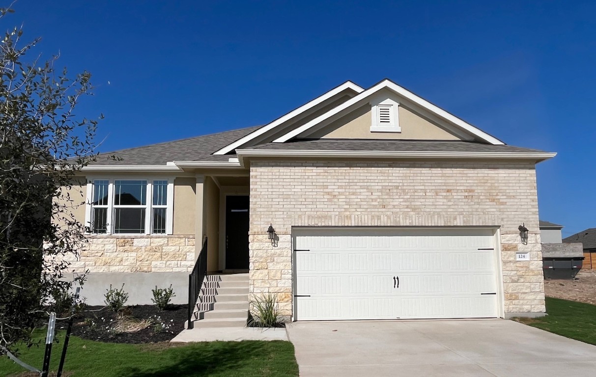 a front view of a house with yard