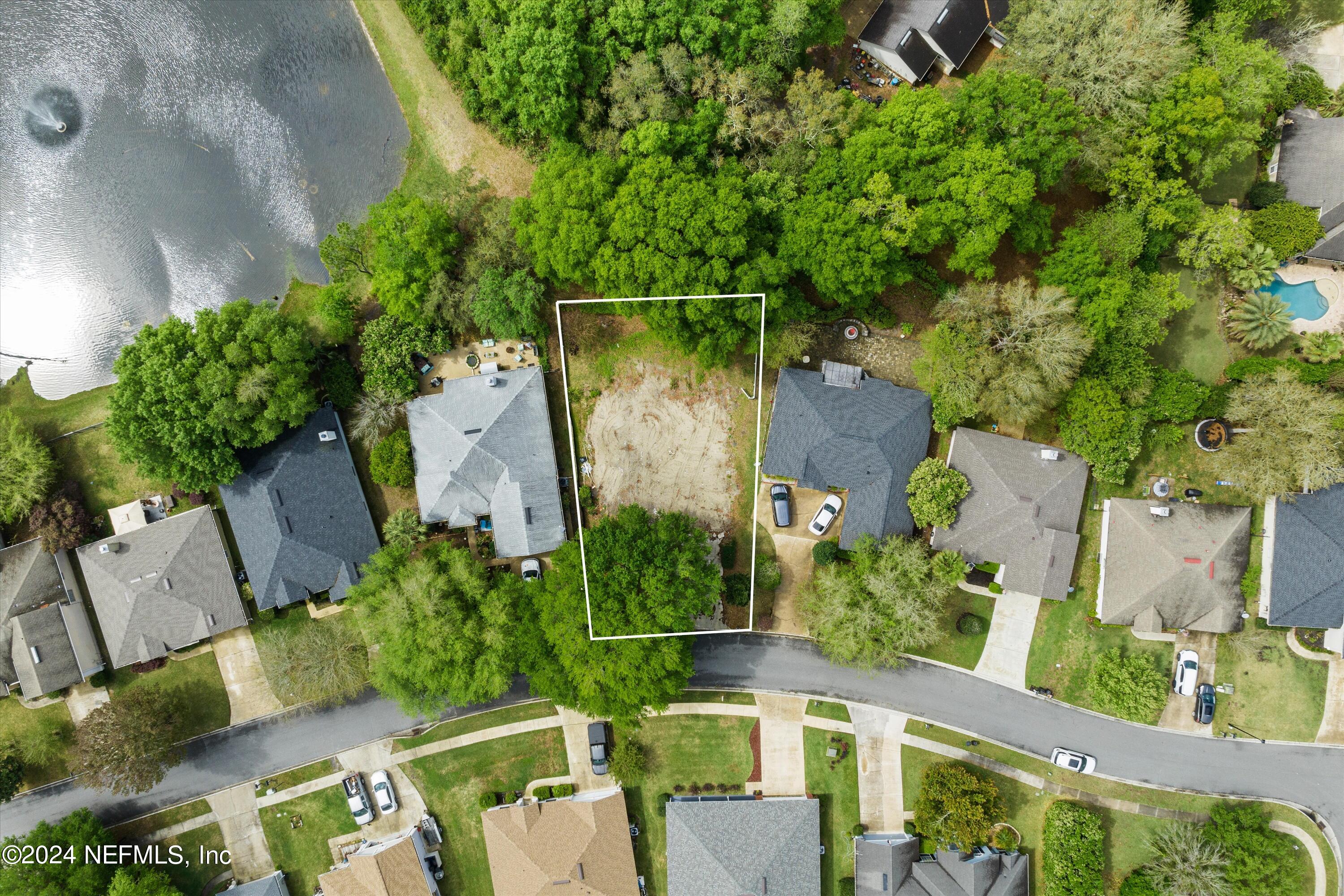 an aerial view of a house with outdoor space