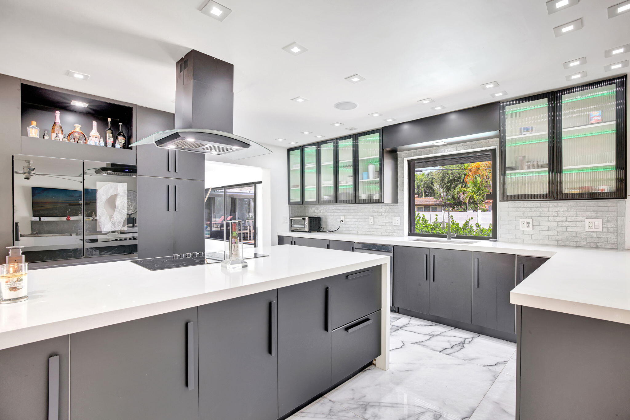 a kitchen with a sink stainless steel appliances and cabinets