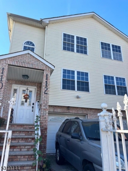 a view of a house with a couches and a potted plant