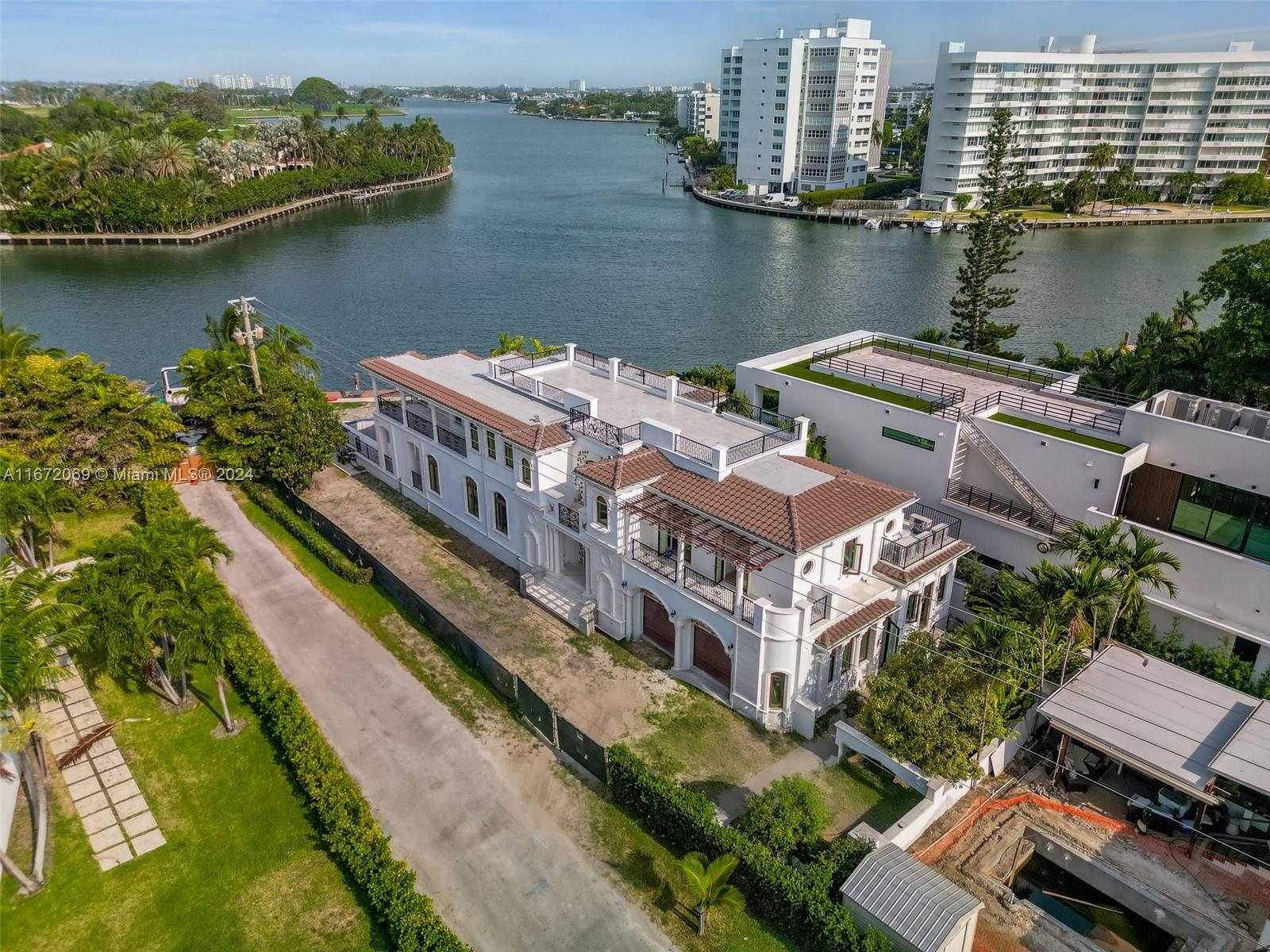 an aerial view of a house with a lake view