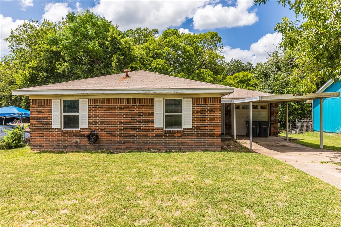 a front view of a house with a yard and porch