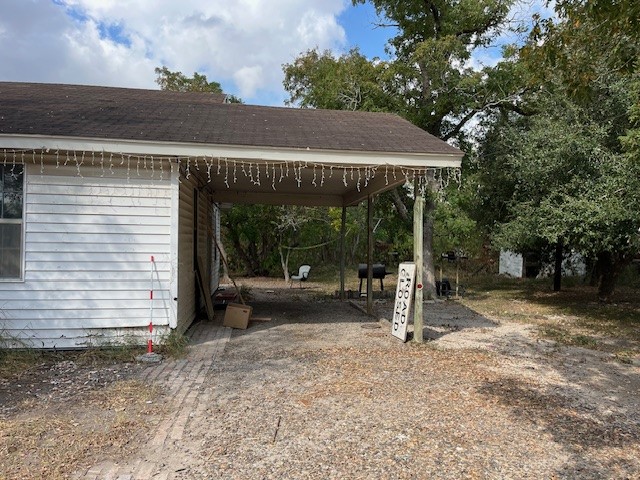 a view of a house with backyard and a patio