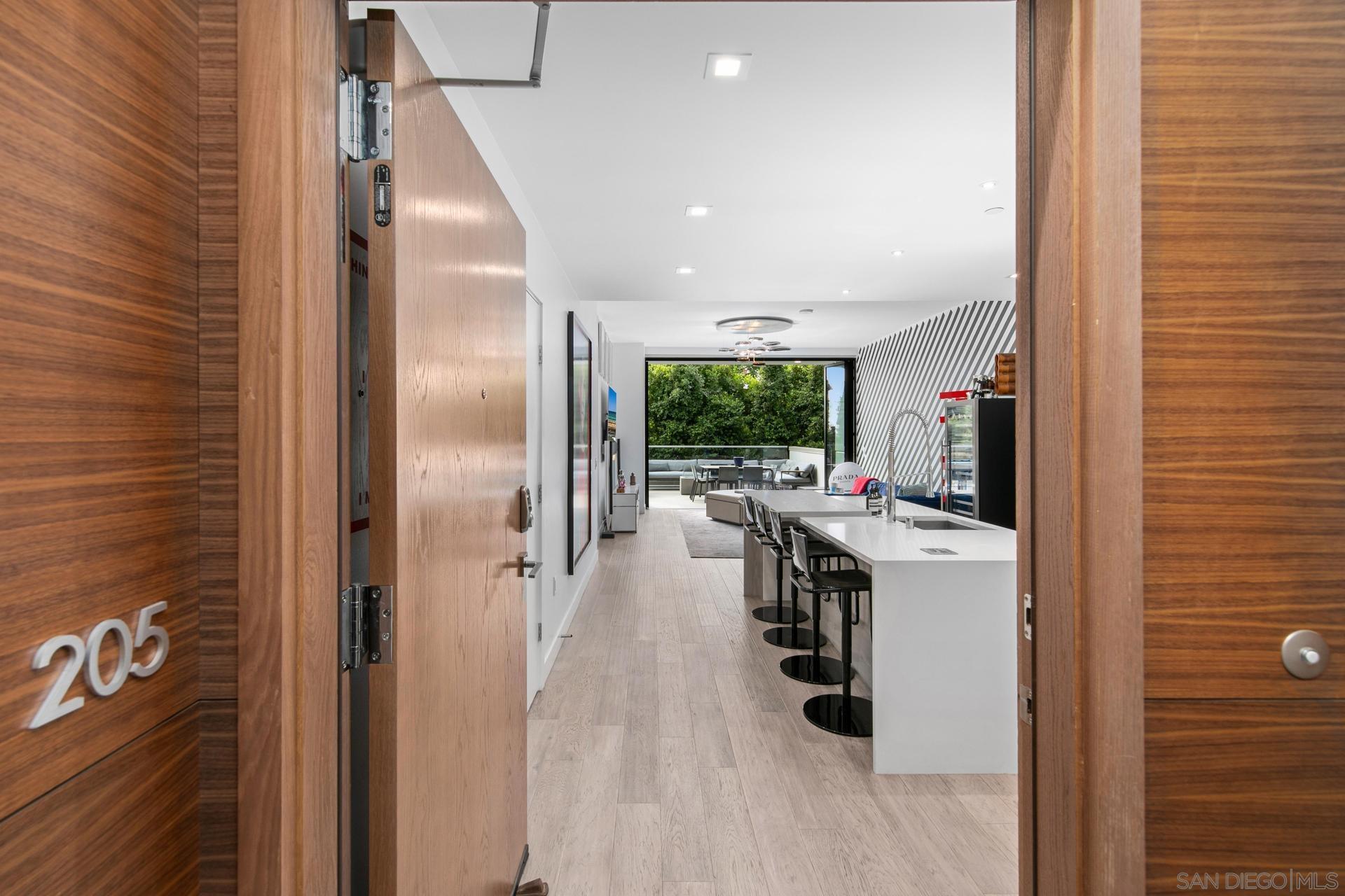 a kitchen with stainless steel appliances a refrigerator and a stove