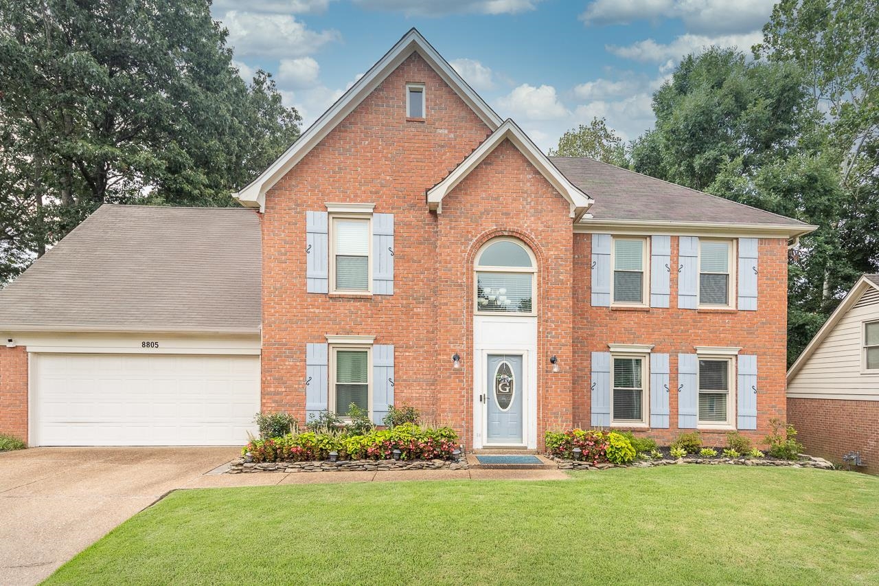 View of front of property with a front yard