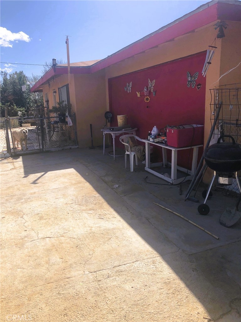 a view of a chairs and tables in the patio