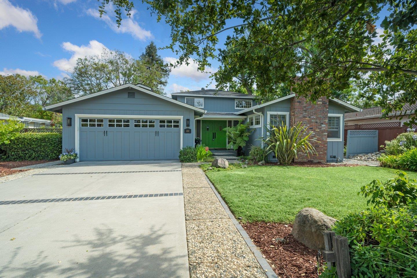 a front view of a house with garden