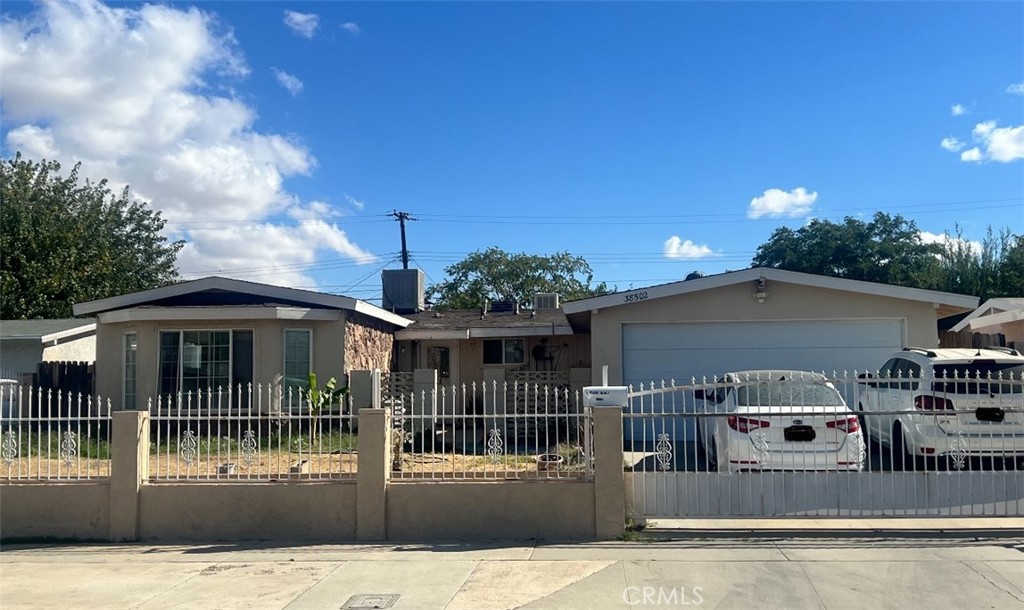 a view of a house with entrance gate