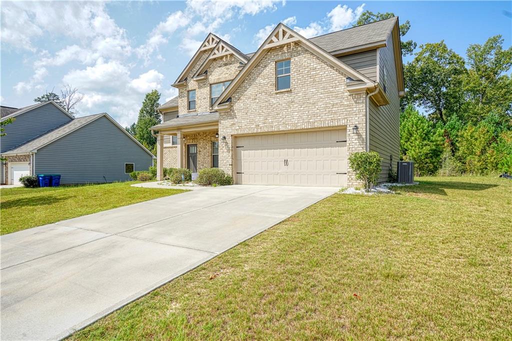 a front view of a house with a yard