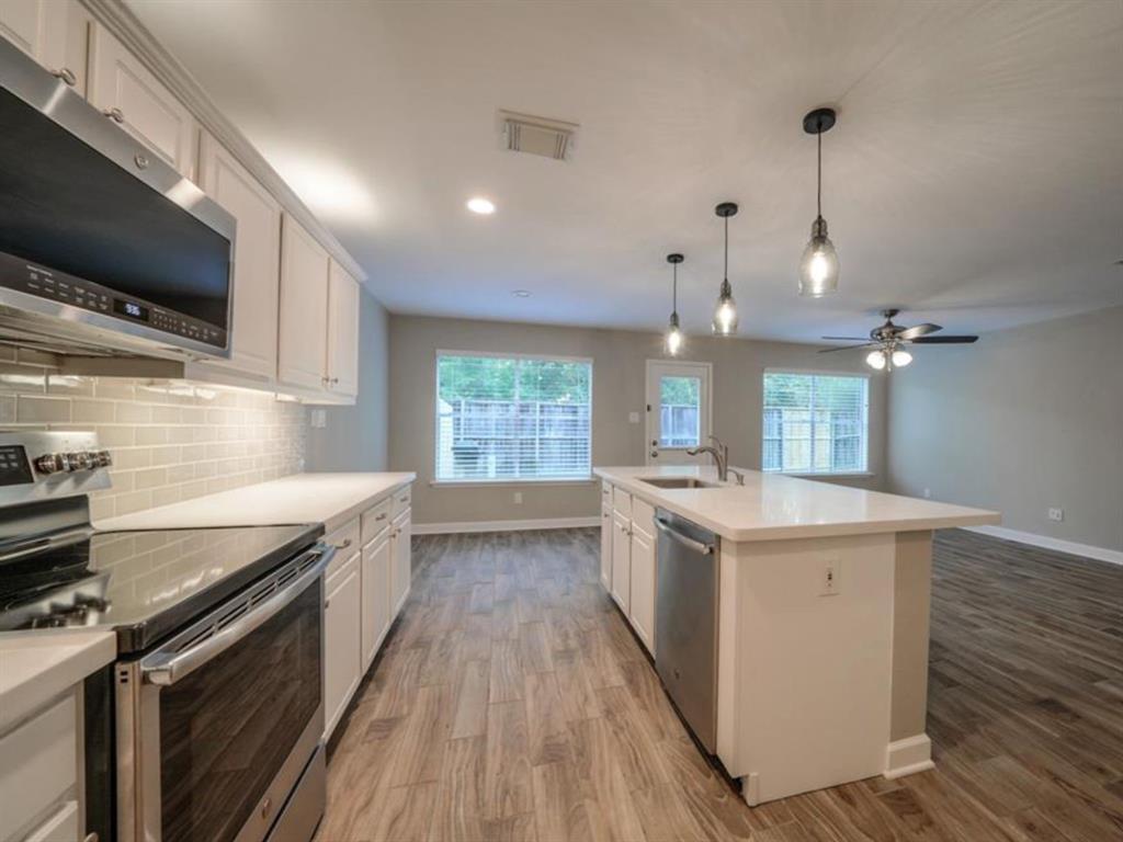 Updated Kitchen opens to living and dining areas. No back neighbors!