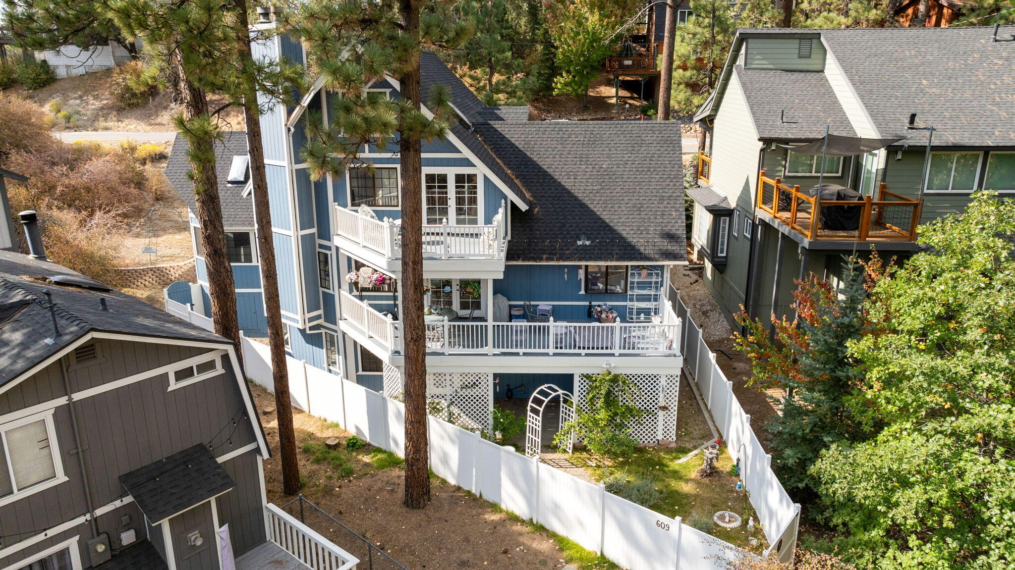 an aerial view of residential houses with yard