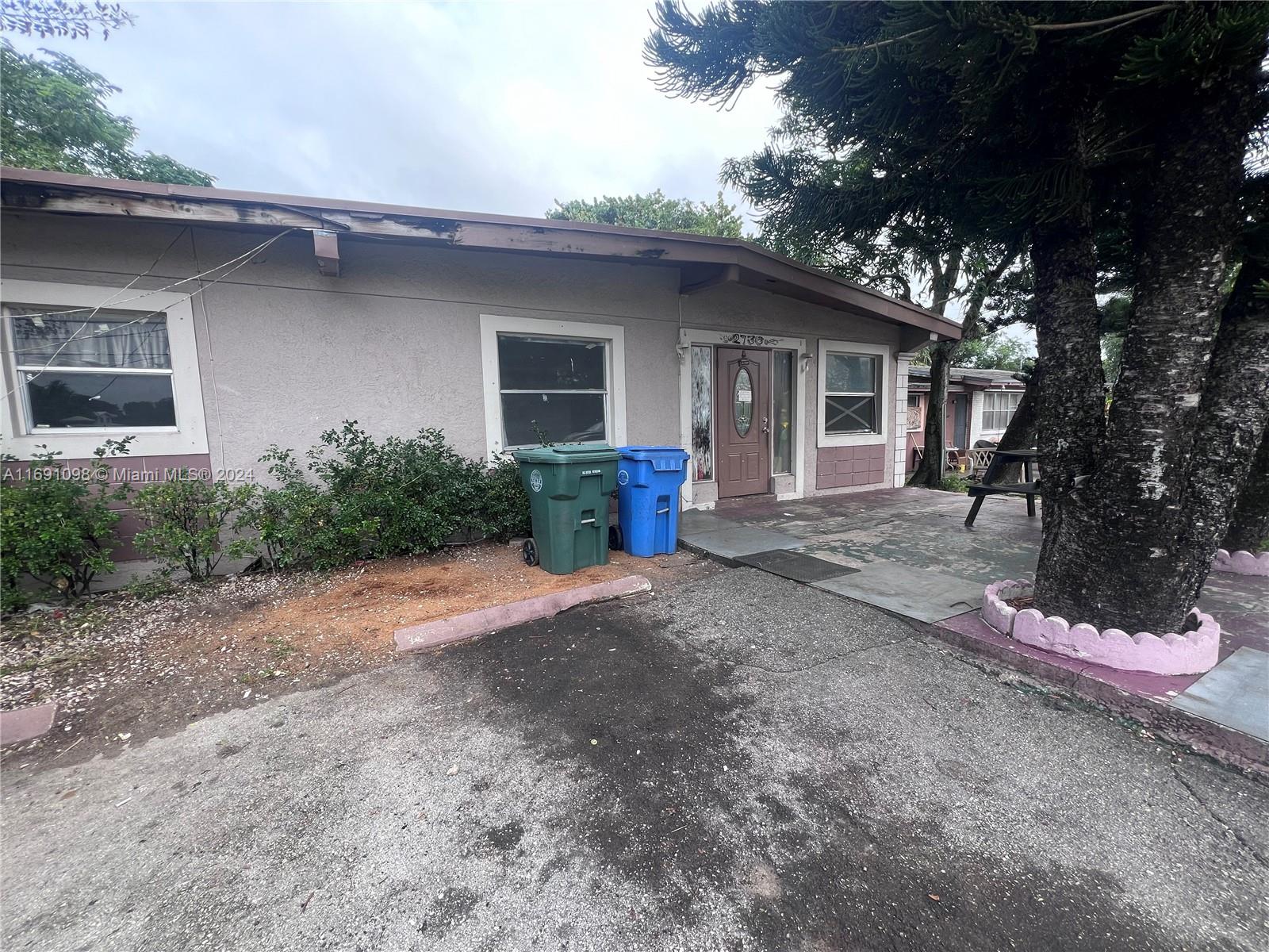 a front view of a house with yard