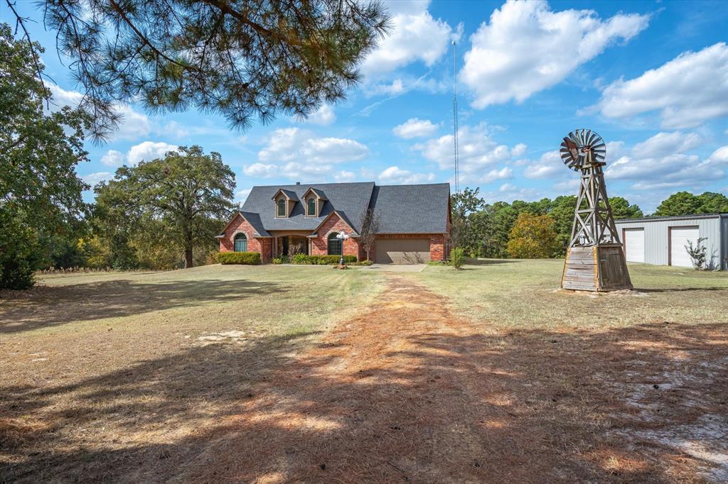 a view of a house with basketball court