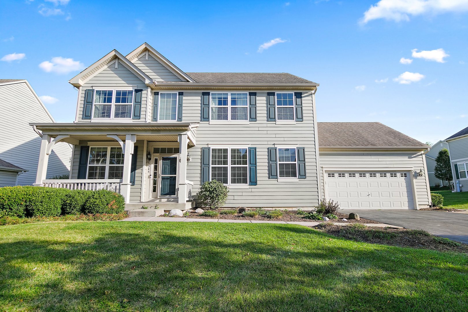 front view of a house with a yard